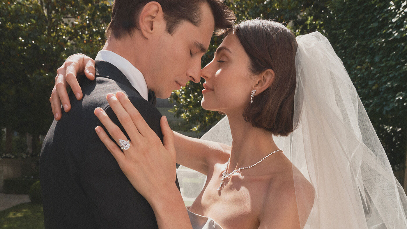 Engagement and Bridal - image shows couple wearing Graff bridal jewellery and Graff diamond engagement ring.