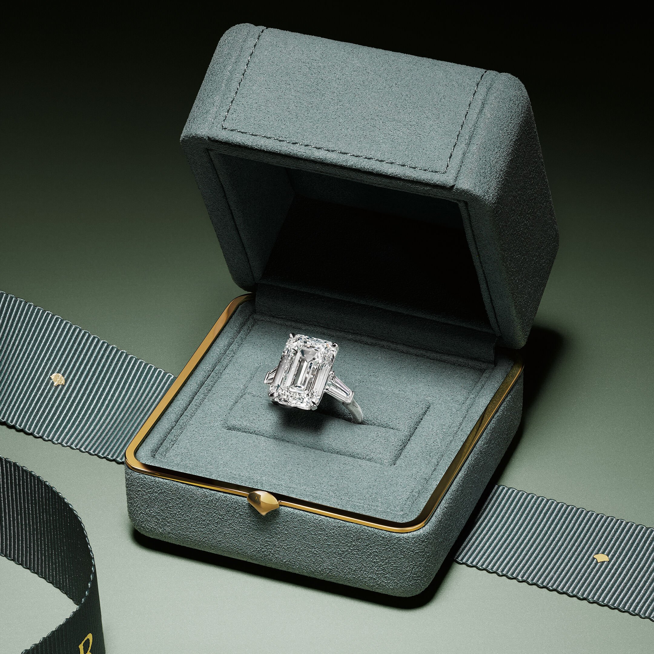 Valentine's Day Gifts - Image shows models holding hands wearing Laurence Graff Signature collection Rings and Bangles