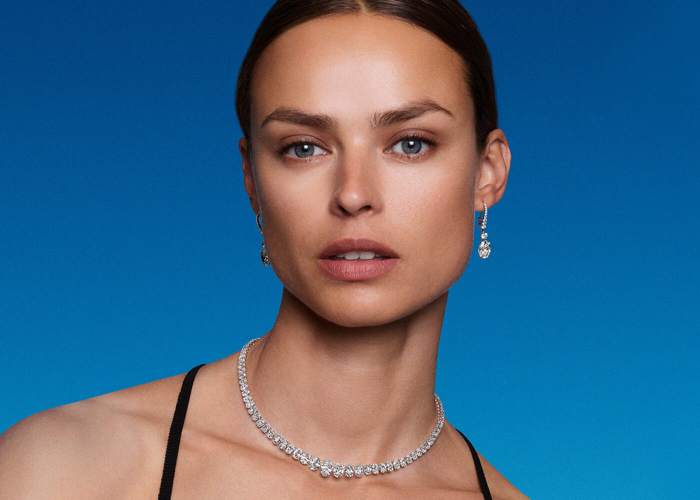 Model wears oval diamond jewellery