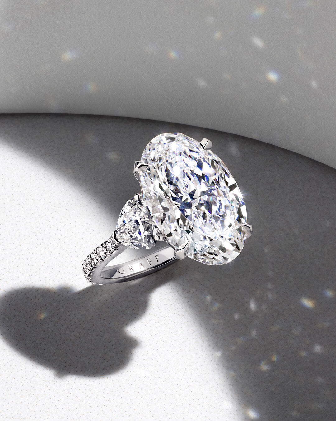 Image shows Graff Oval cut diamond engagement ring.