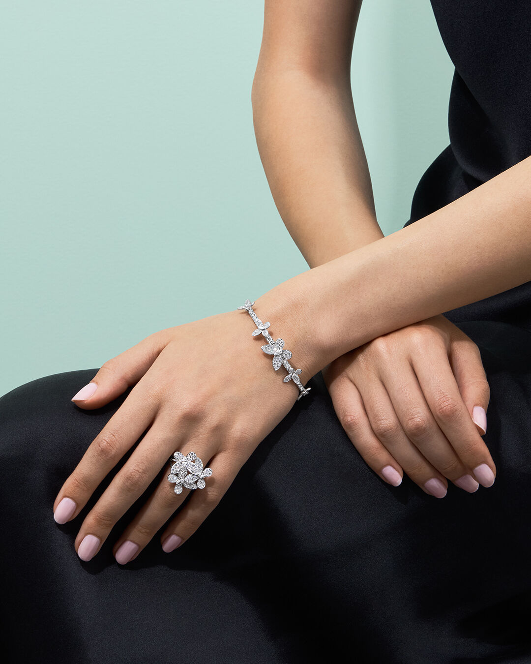 Image shows model wearing Graff Butterfly bracelet and ring