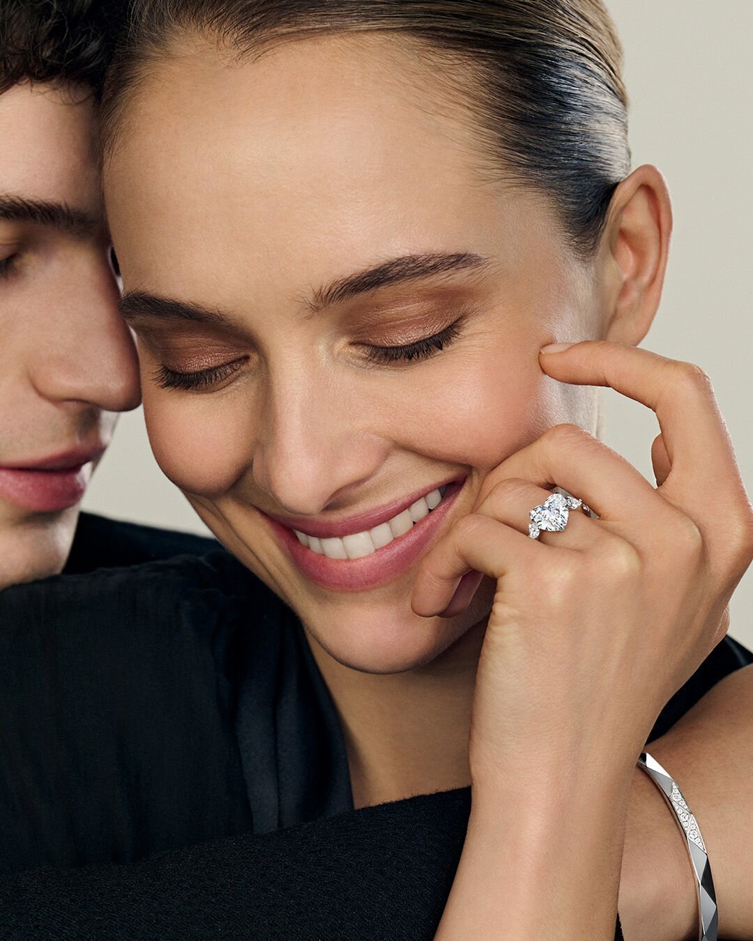 Image shows model wearing heart shape diamond engagement ring