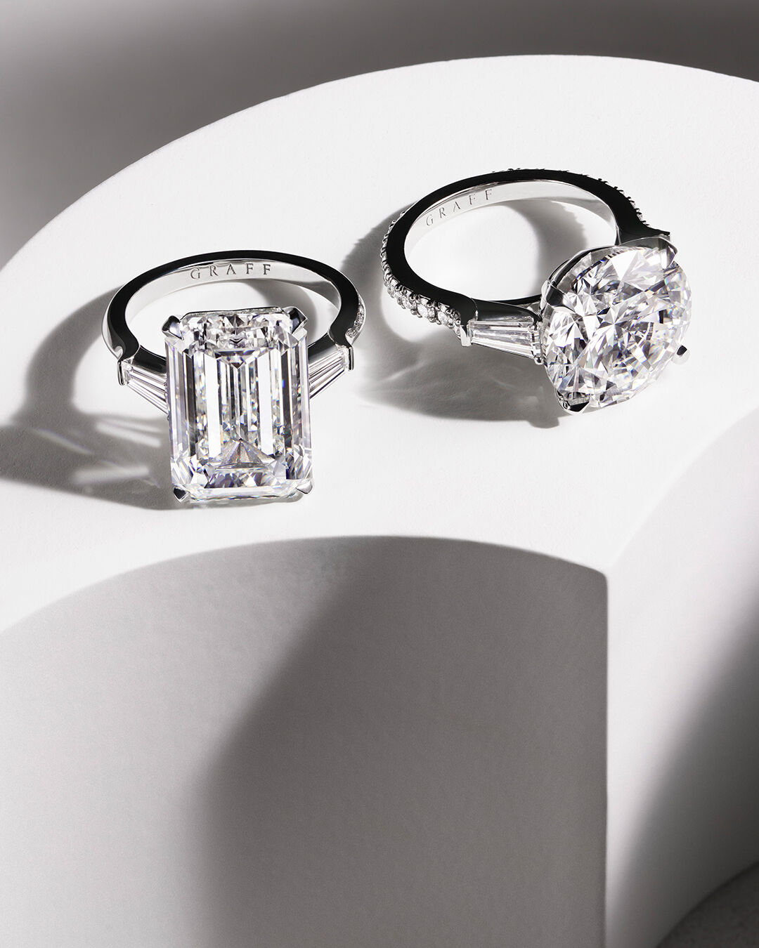 Image shows Graff Diamond Emerald cut and Round diamond engagement ring 