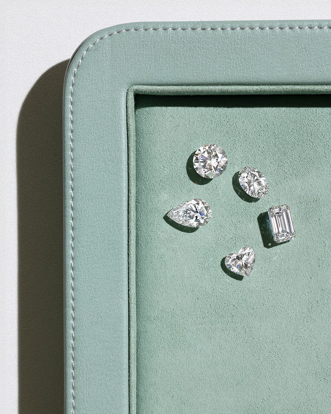 A Guide to Diamond Cuts and Diamond Shapes - image shows loose Graff diamond of different cuts and shapes