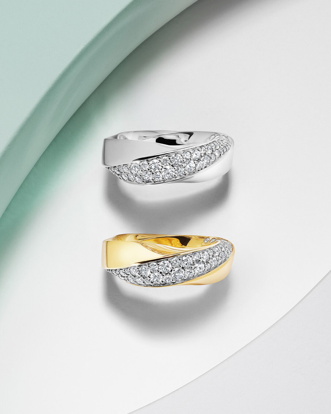 Image shows White Gold and Yellow Gold Spiral Rings