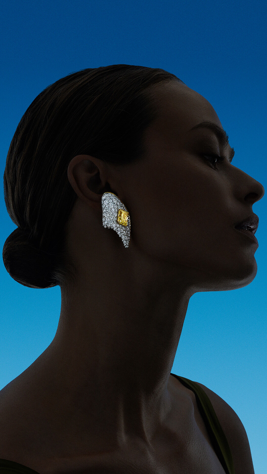 Endless Summer - image shows model wearing Graff Yellow and White Diamond high jewellery earrings