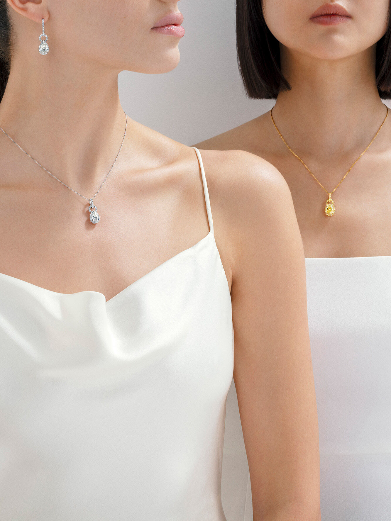 Image shows models wearing Icon 8 earrings and necklace 