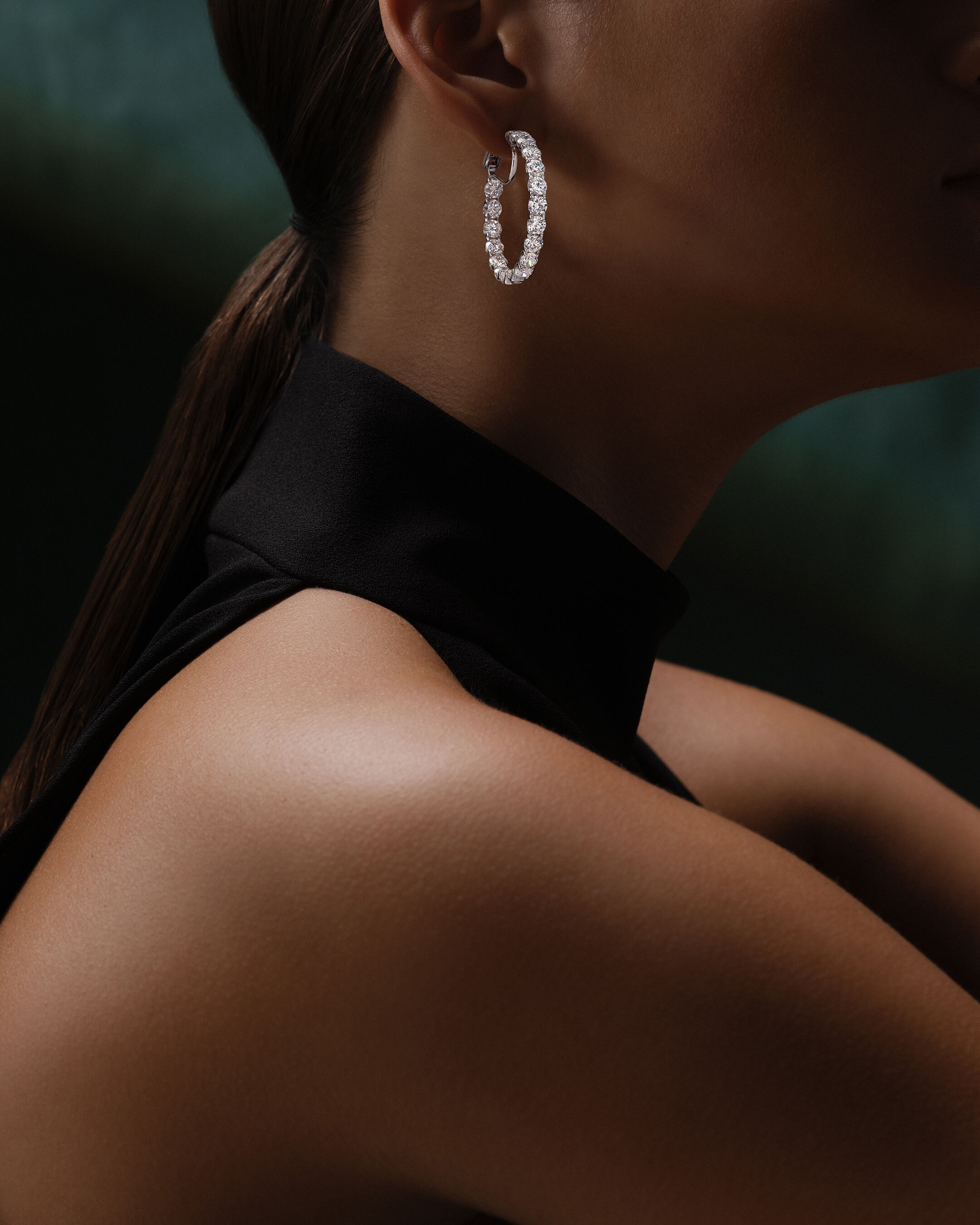 Image shows model wearing Laurence Graff Signature rings and bangles