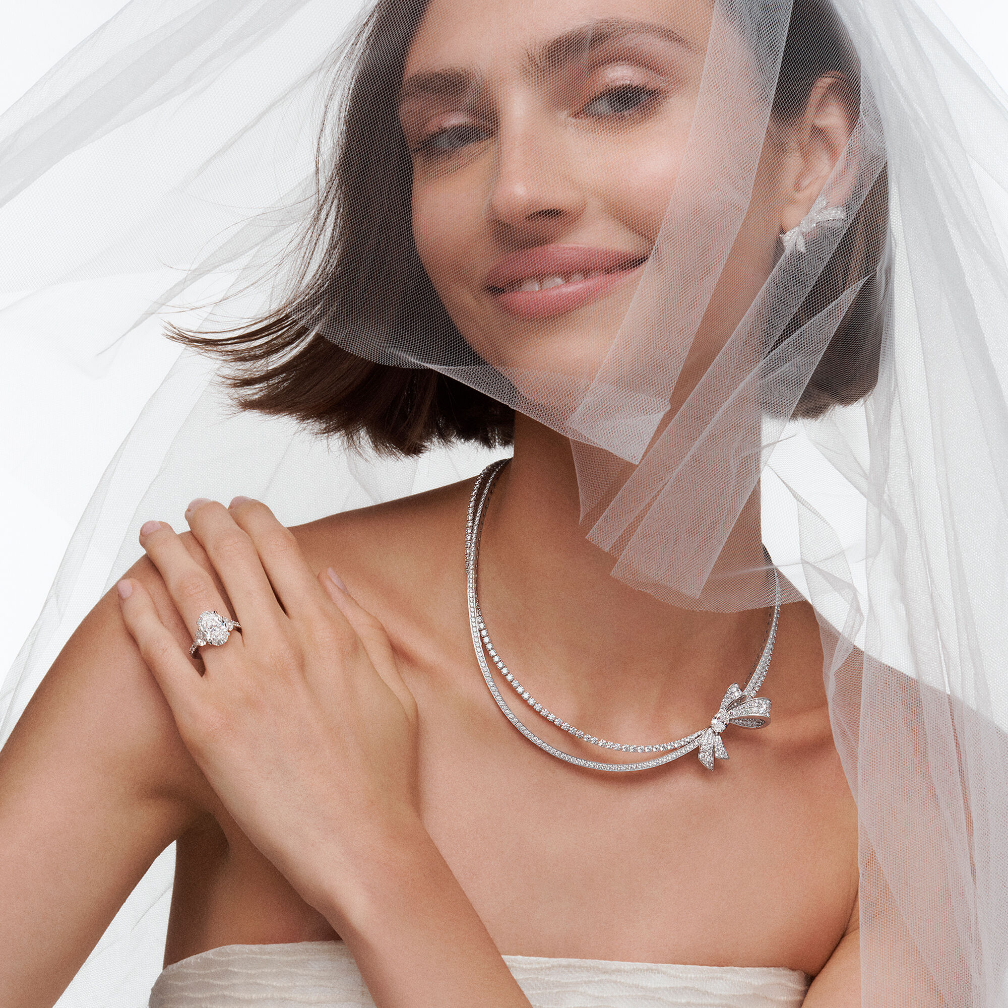 Model wears Graff Bridal Jewellery necklace and earrings