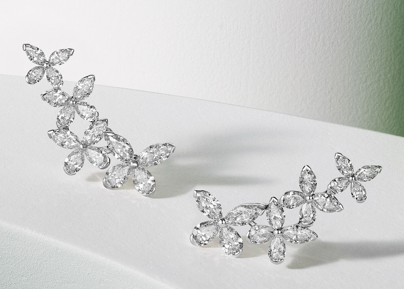 Image shows Graff Butterfly Ear climber stud earrings