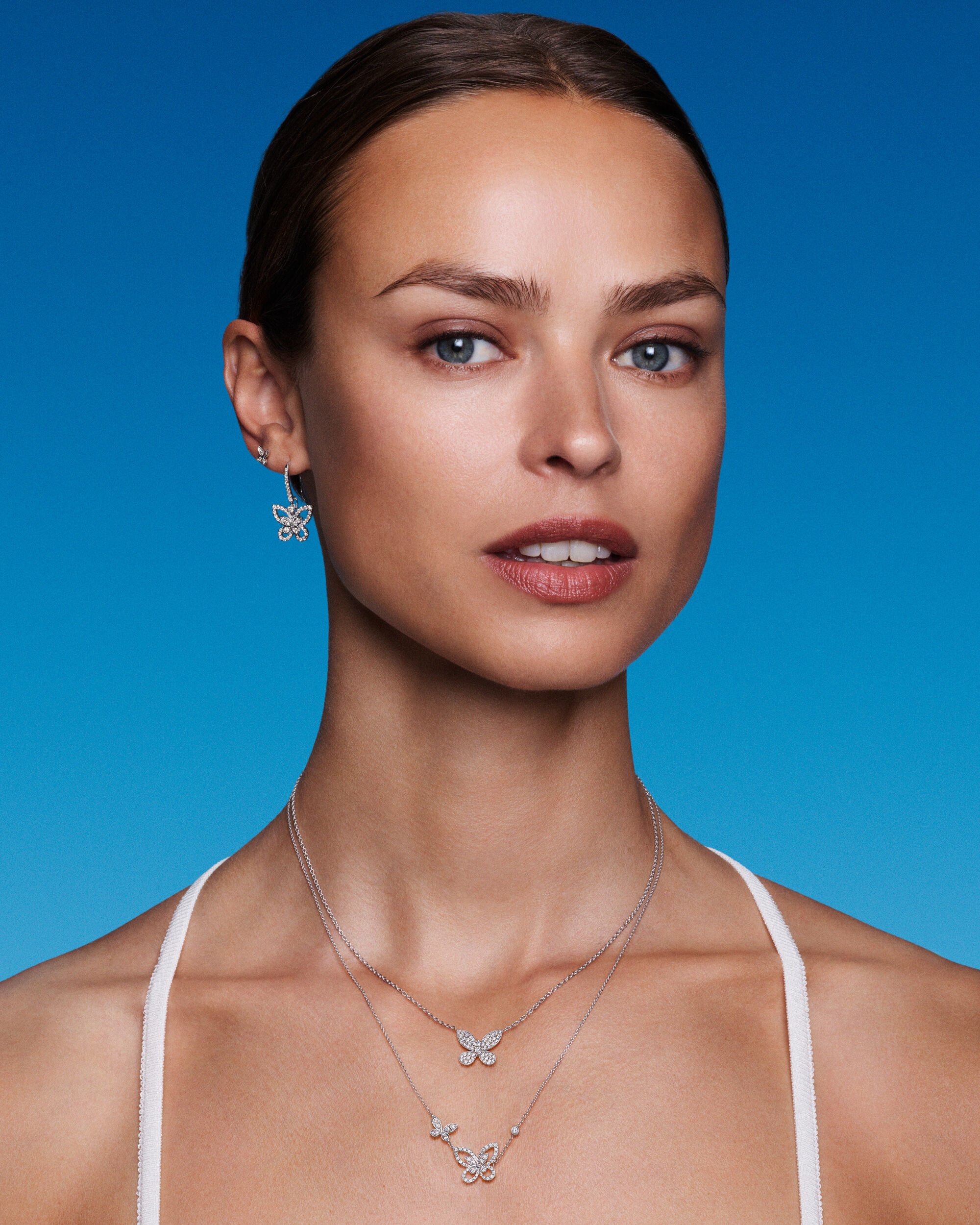 Image of model wearing Graff Butterfly diamond jewellery