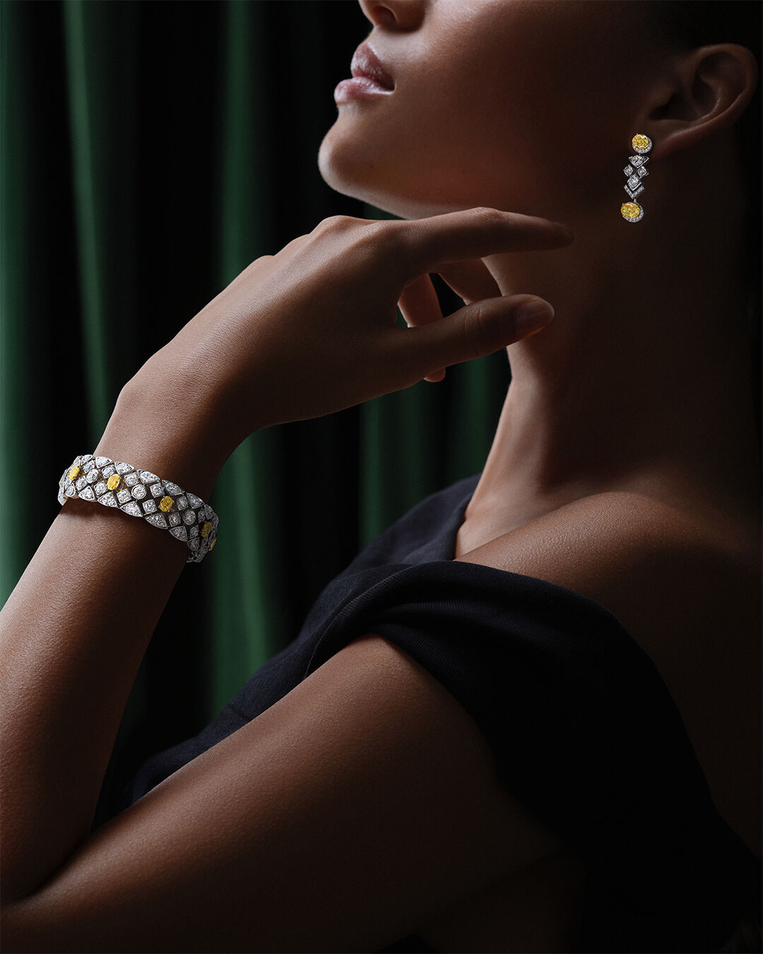Image shows model wearing Graff Icon 8 Earrings and Pendant