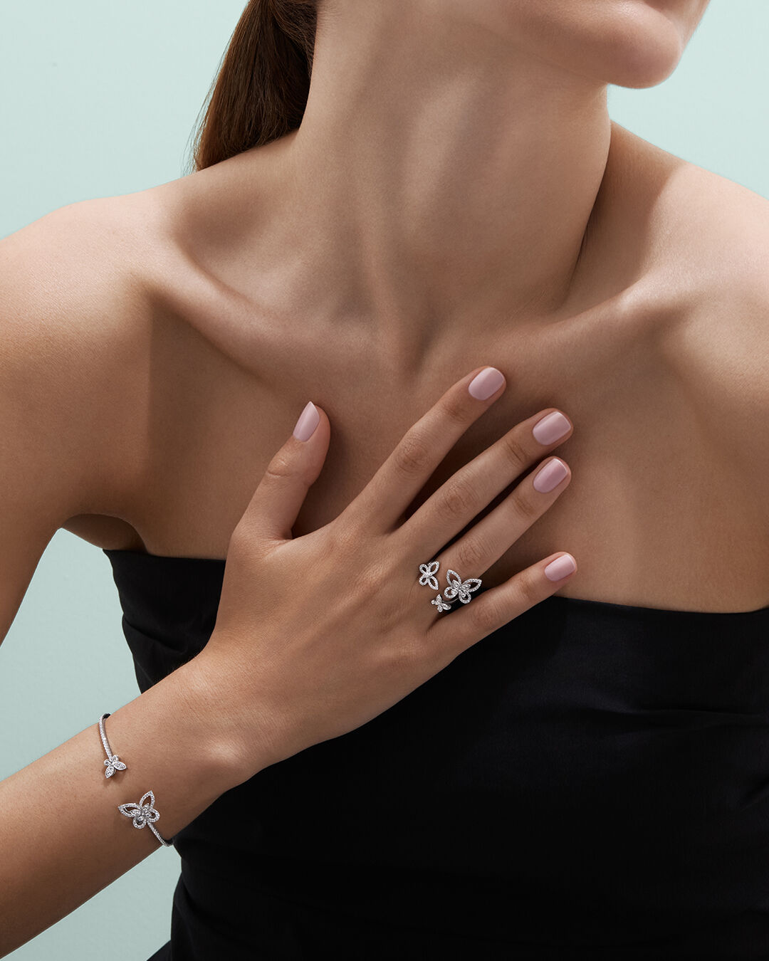 Image shows model wearing Graff Butterfly ring and bangle