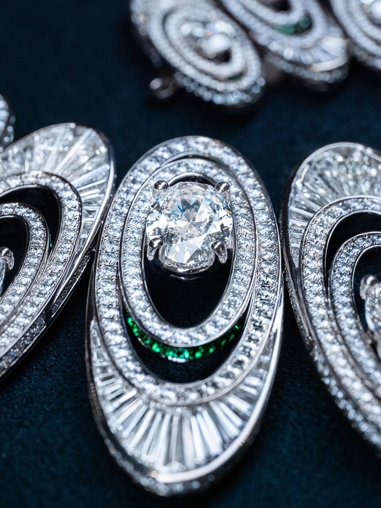 Graff 1963 High Jewellery Suite making of, image shows graff craftsman creating necklace in workshop