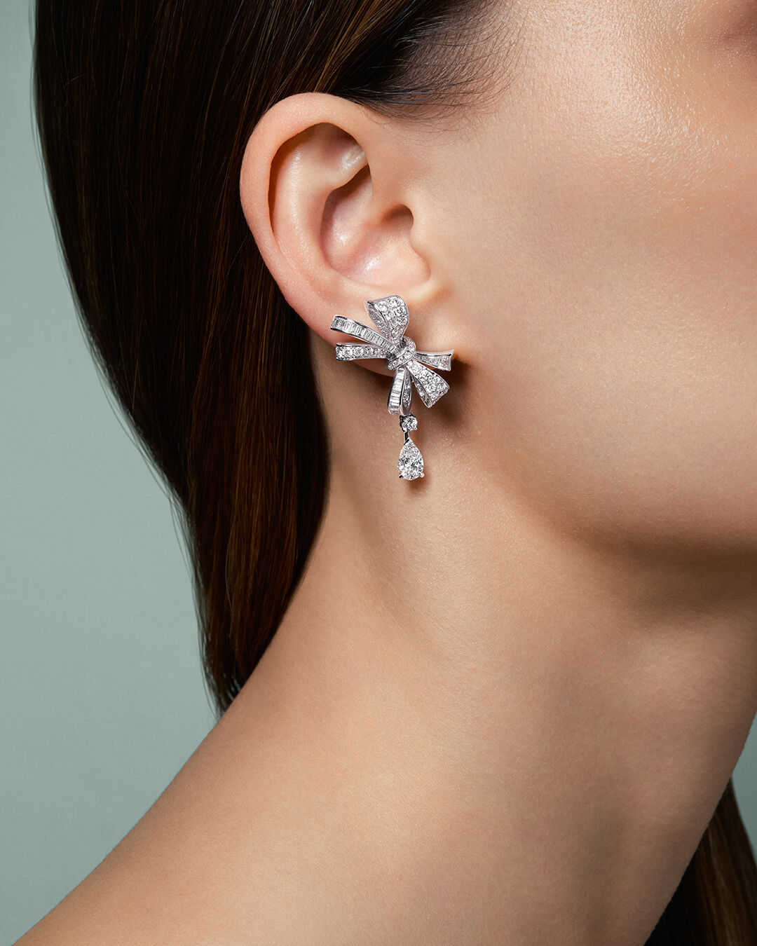 Image of model hands wearing Graff Tilda's Bow ring and bracelet 