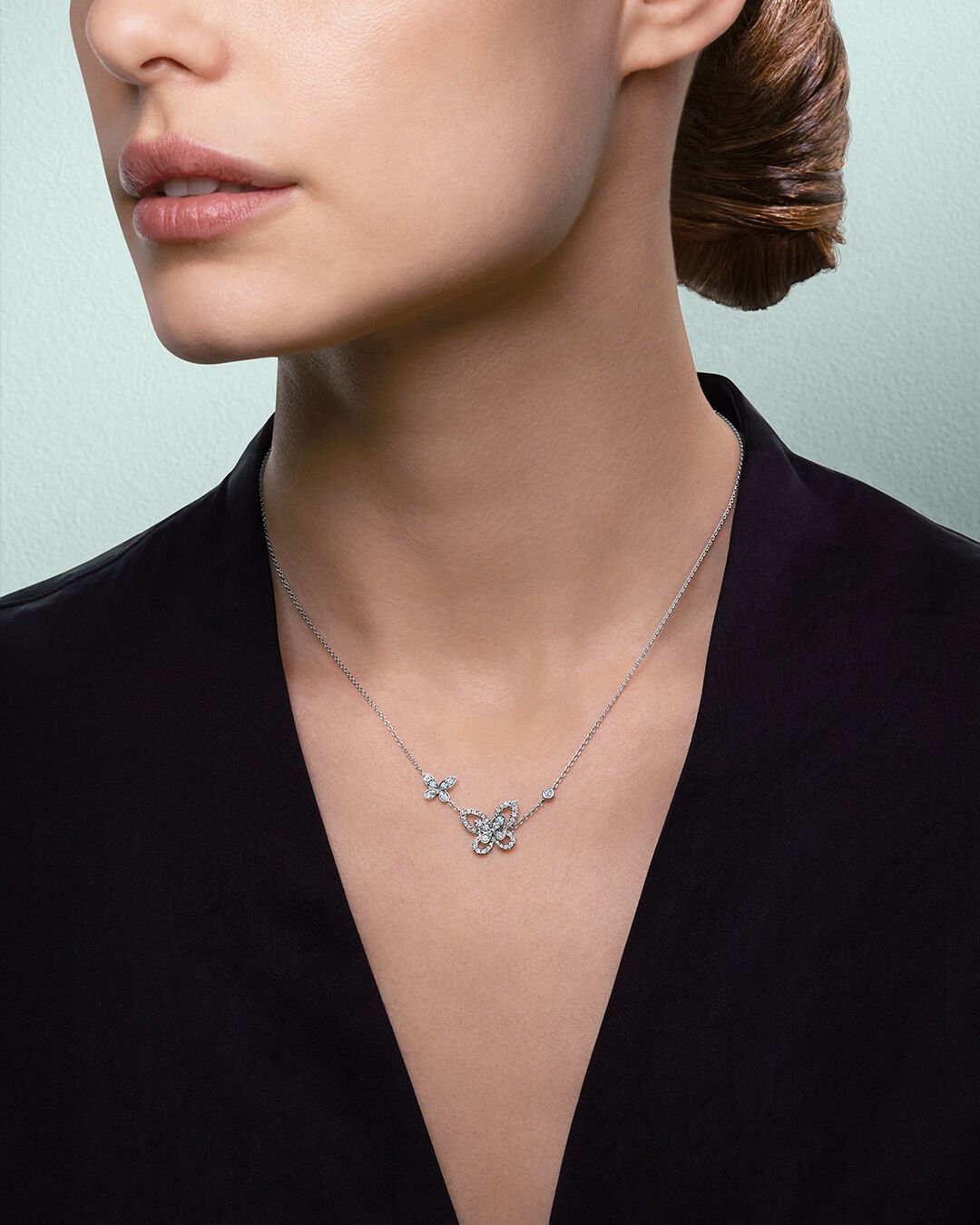 Image shows model wearing Graff Butterfly Double Silhouette diamond necklace 