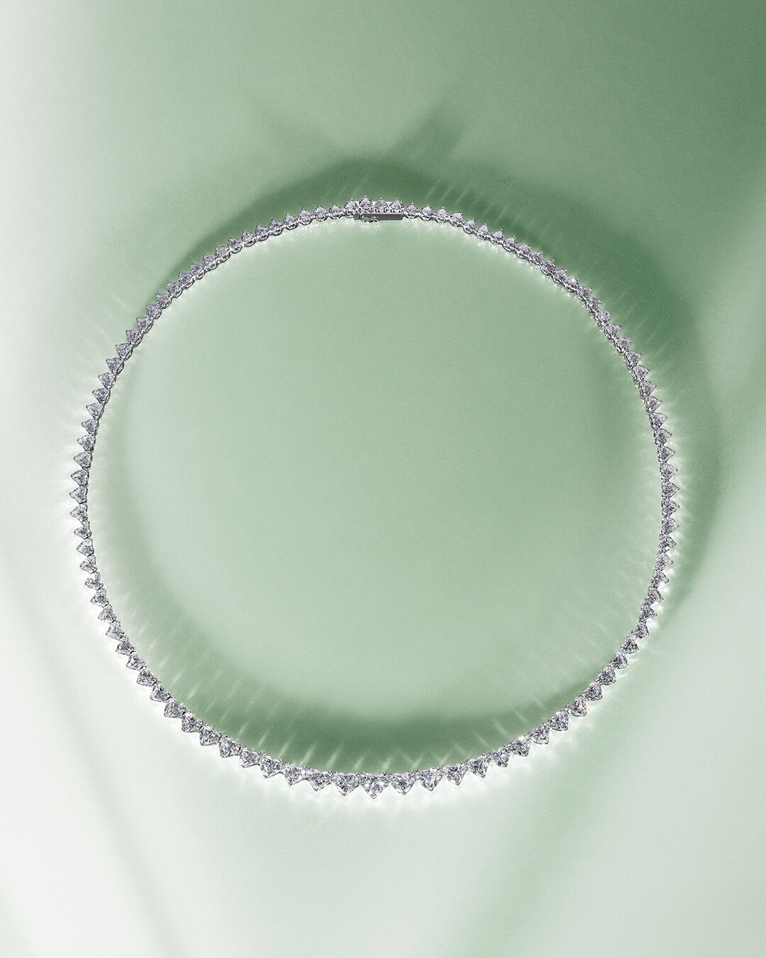 Image shows model wearing Laurence Graff Signature bangles and rings 