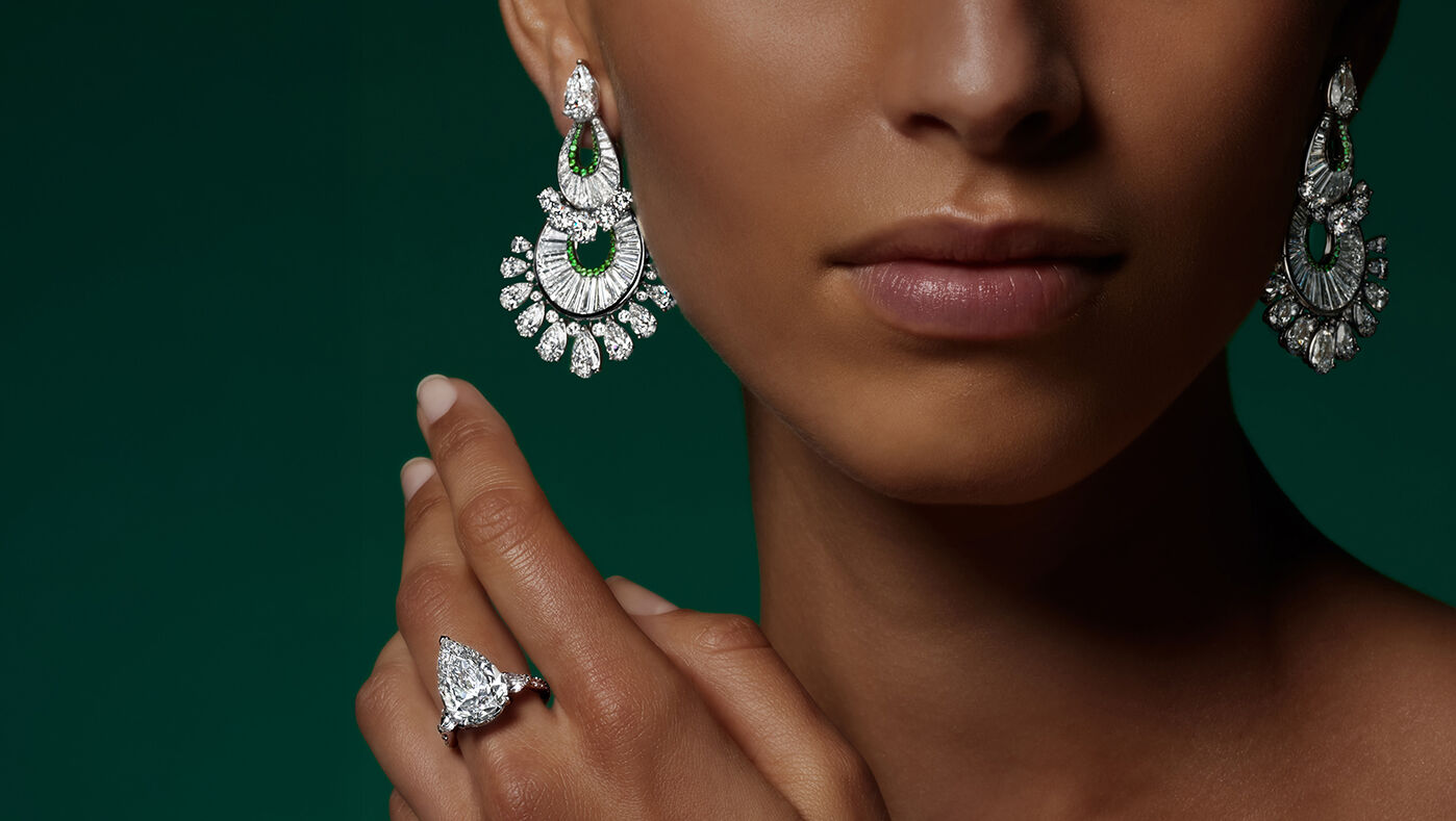 Unique Solitaires - Model wears Graff High Jewellery earrings and ring