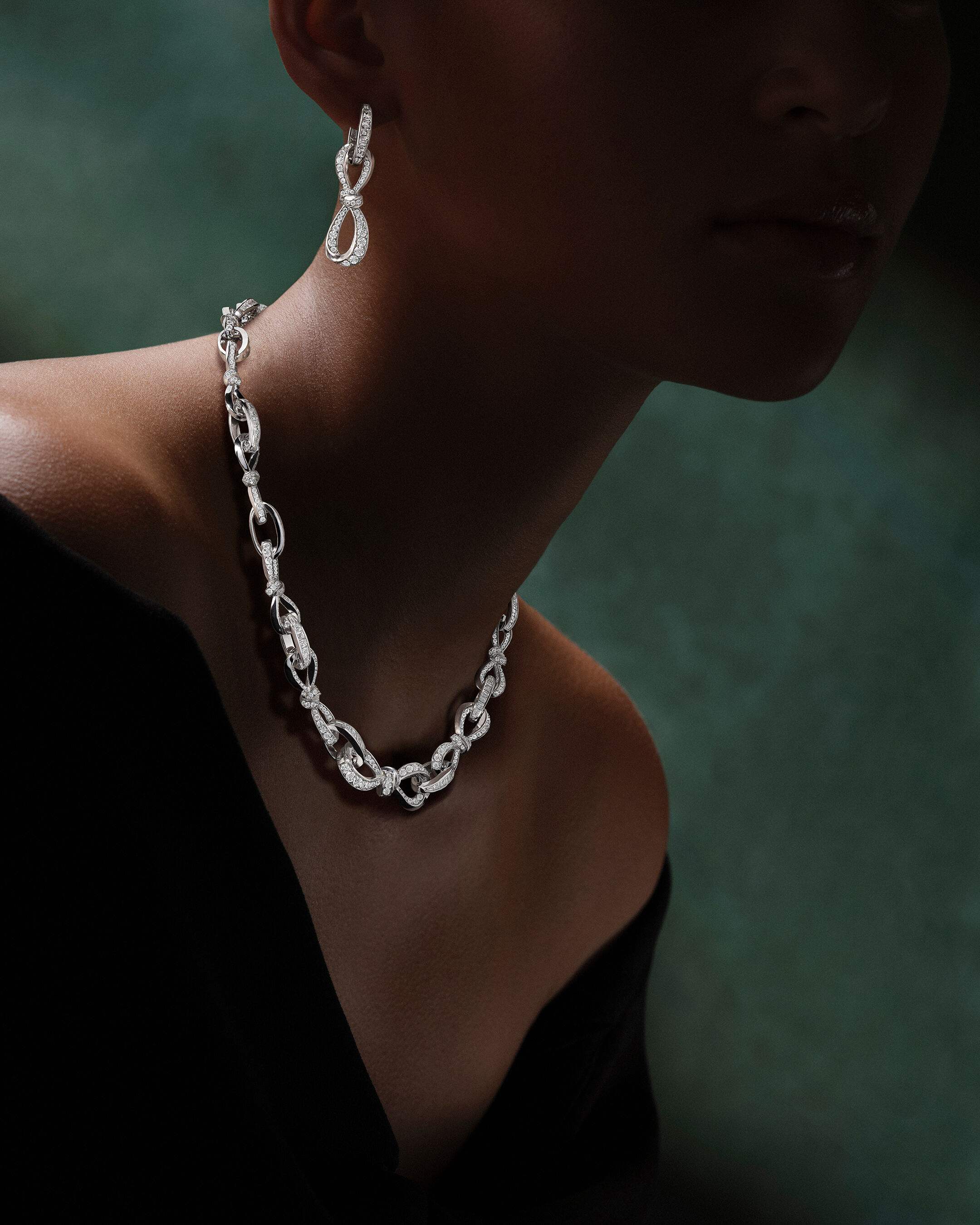 Image shows model wearing Laurence Graff Signature bangles and rings 