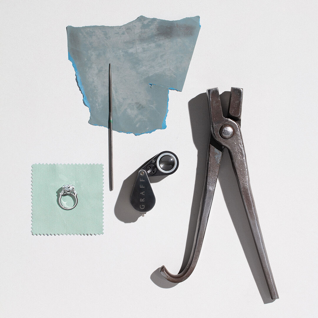A Guide to Diamond Certification - Image shows Graff diamond engagement ring and workshop tools.