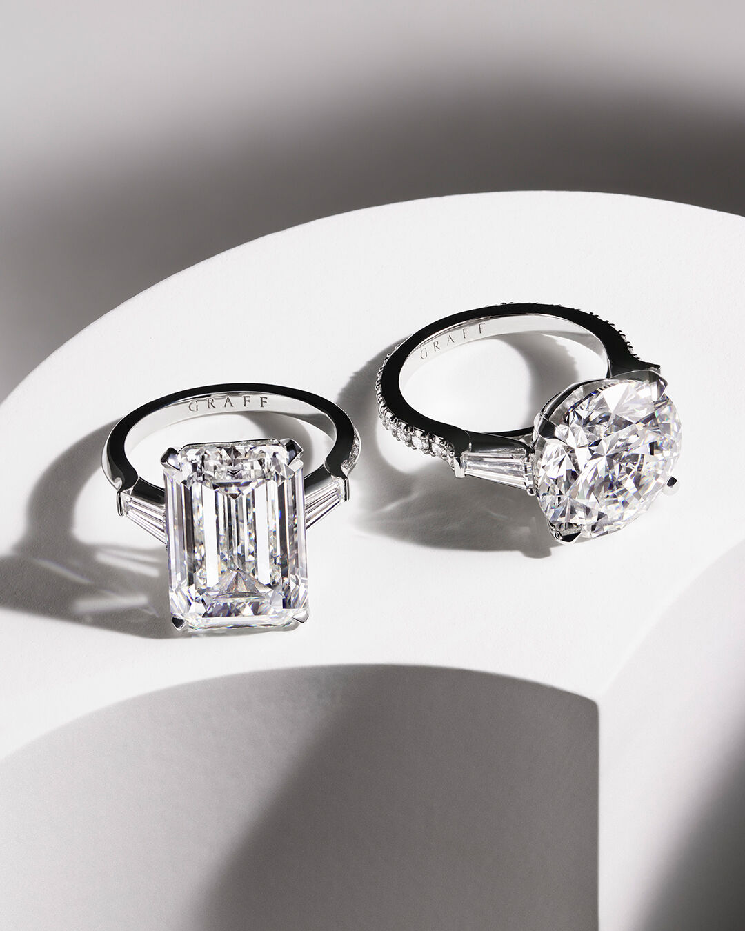 Image shows Graff Emerald Cut and Round Cut Diamond Engagement rings