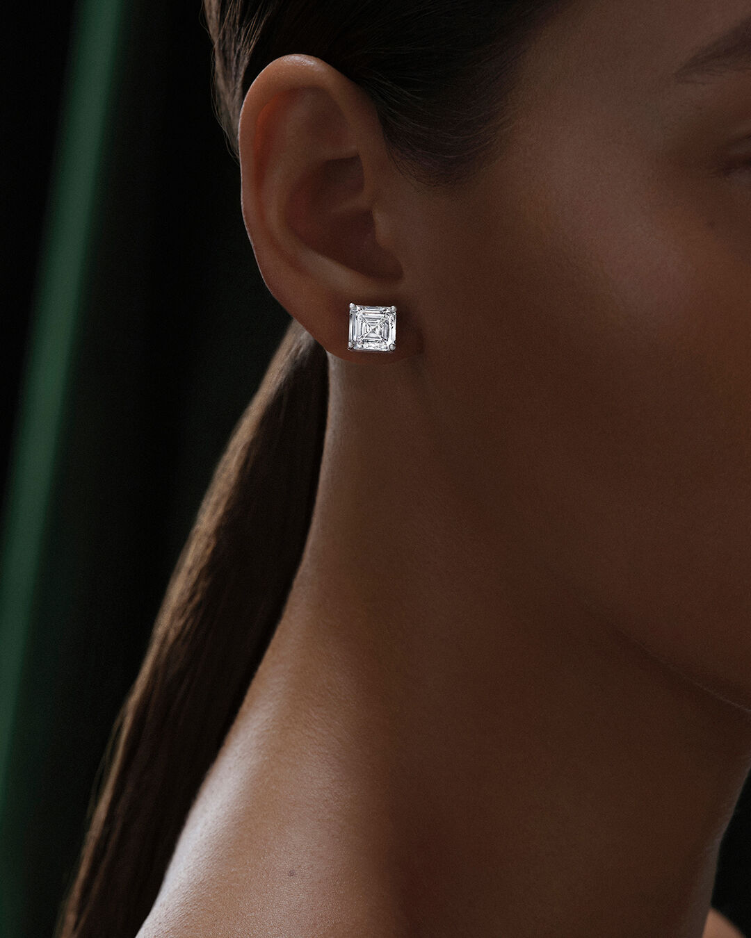 Image shows model wearing Classic Graff Diamond Square Emerald Cut Stud Earring