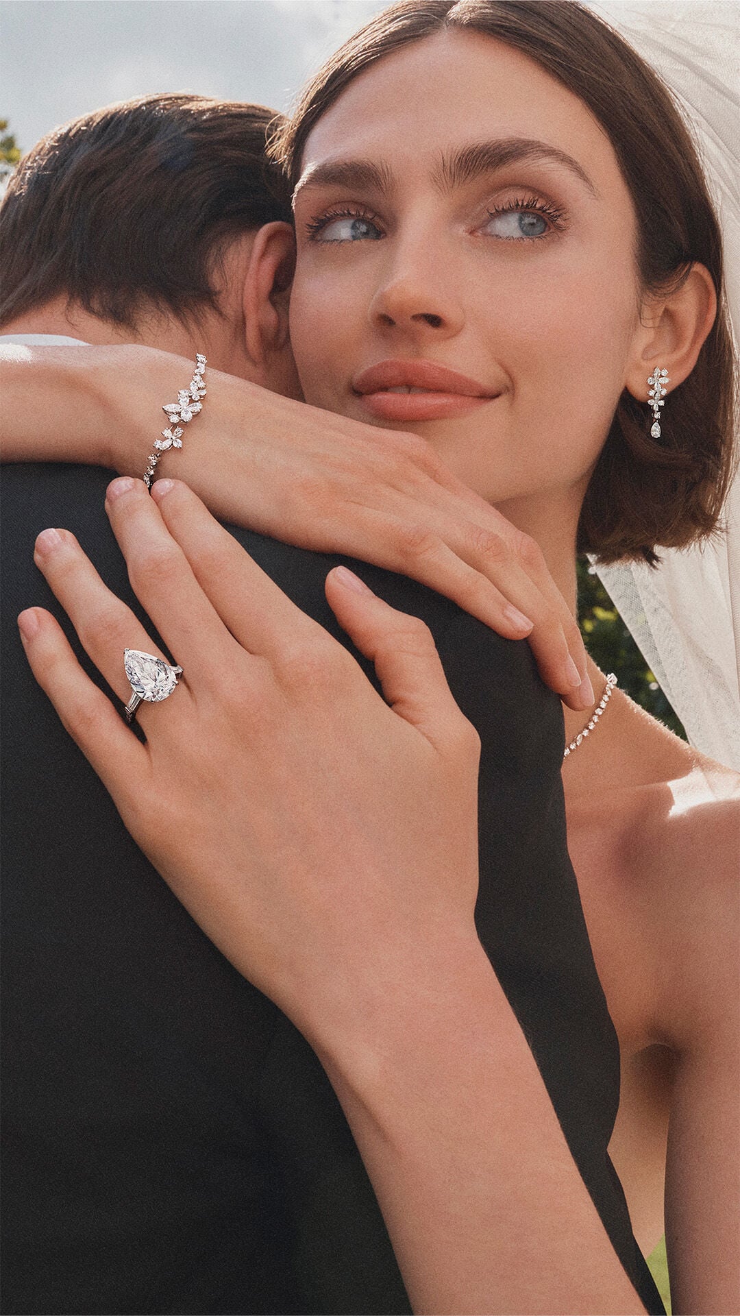 image shows models wearing Graff diamond bridal jewellery