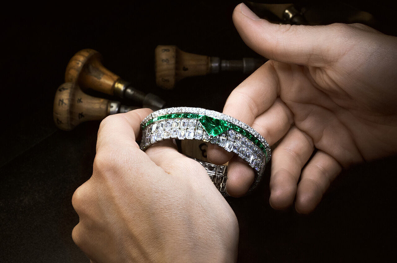 Image shows Graff Craftsman creating Graff Emerald and White Diamond High Jewellery bangle