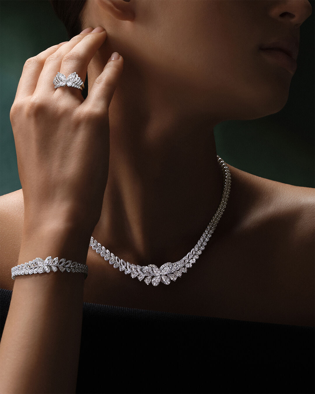 Image shows model wearing Classic Graff Butterfly Necklace, Earrings and Ring