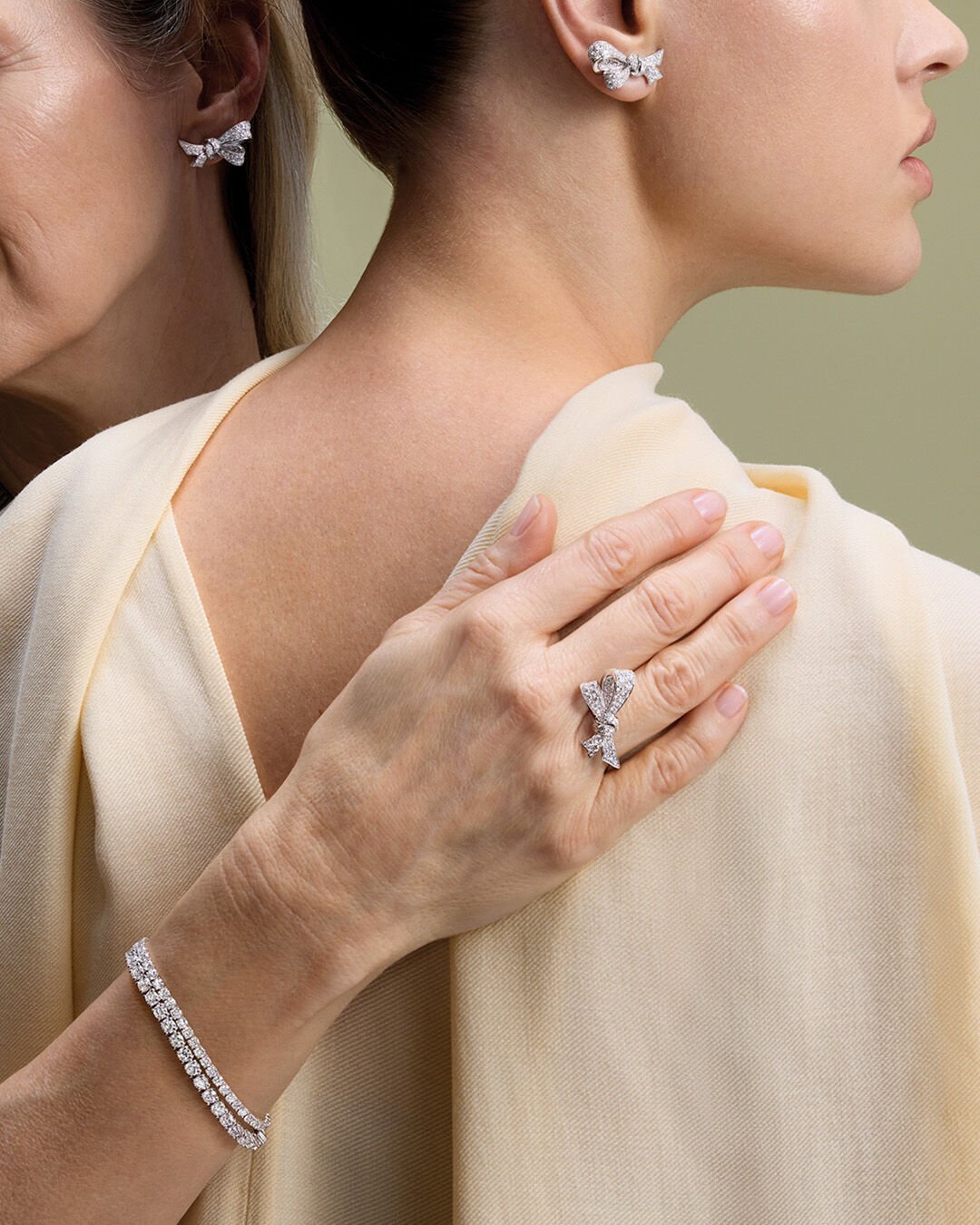 Mother's Day - image shows models wearing Graff TIlda's Bow diamond jewellery and diamond braclets 