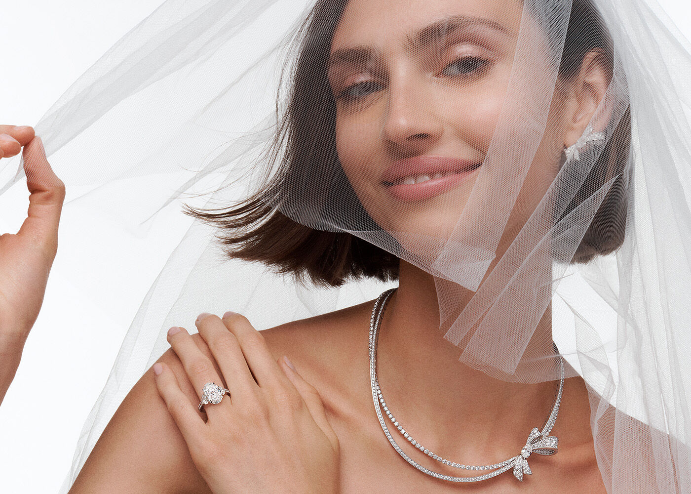 Model wears Graff Bridal Jewellery necklace and earrings