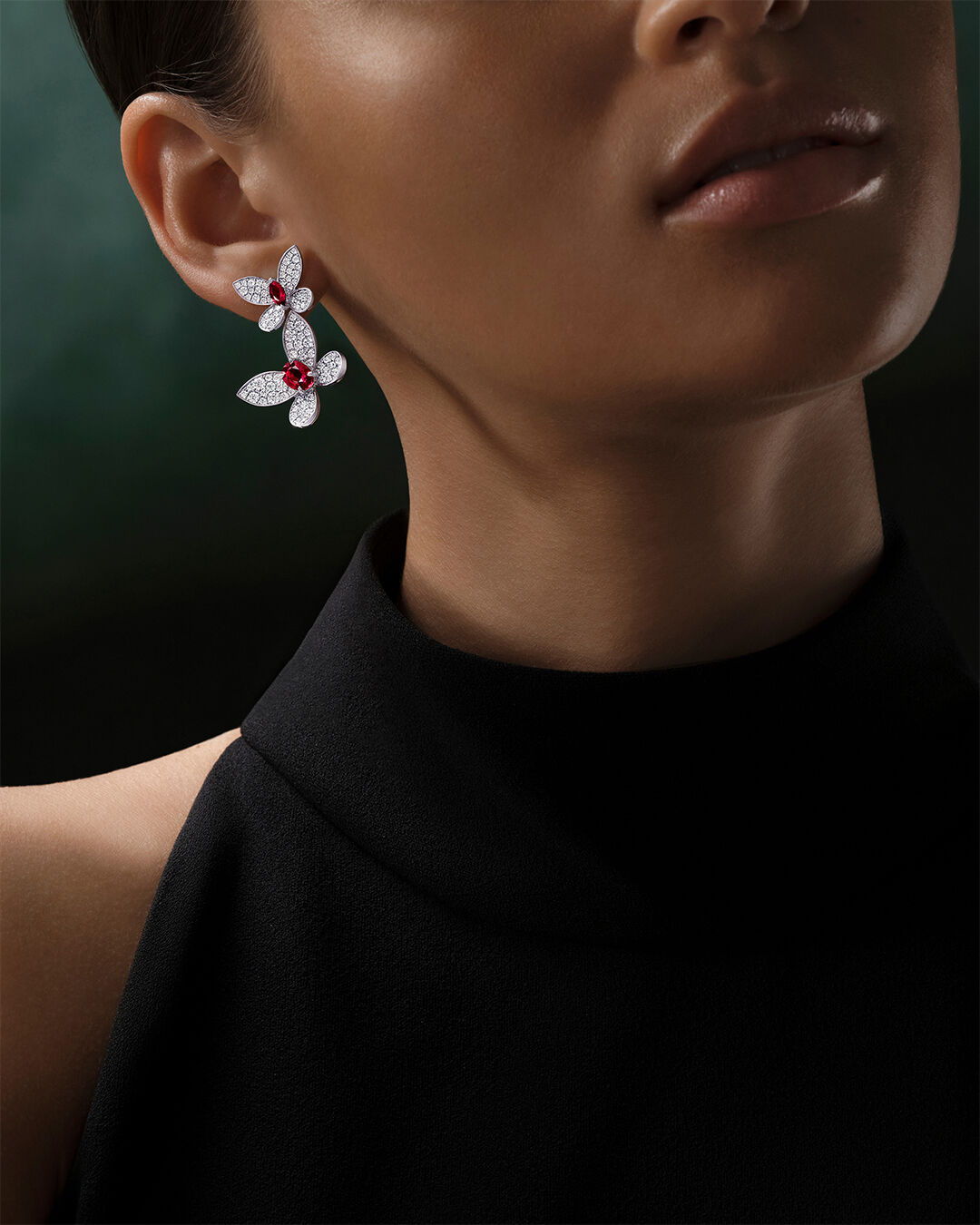 Necklaces and Pendants - image shows model wearing Classic Graff Round, Emerald and Pear cut diamond pendants