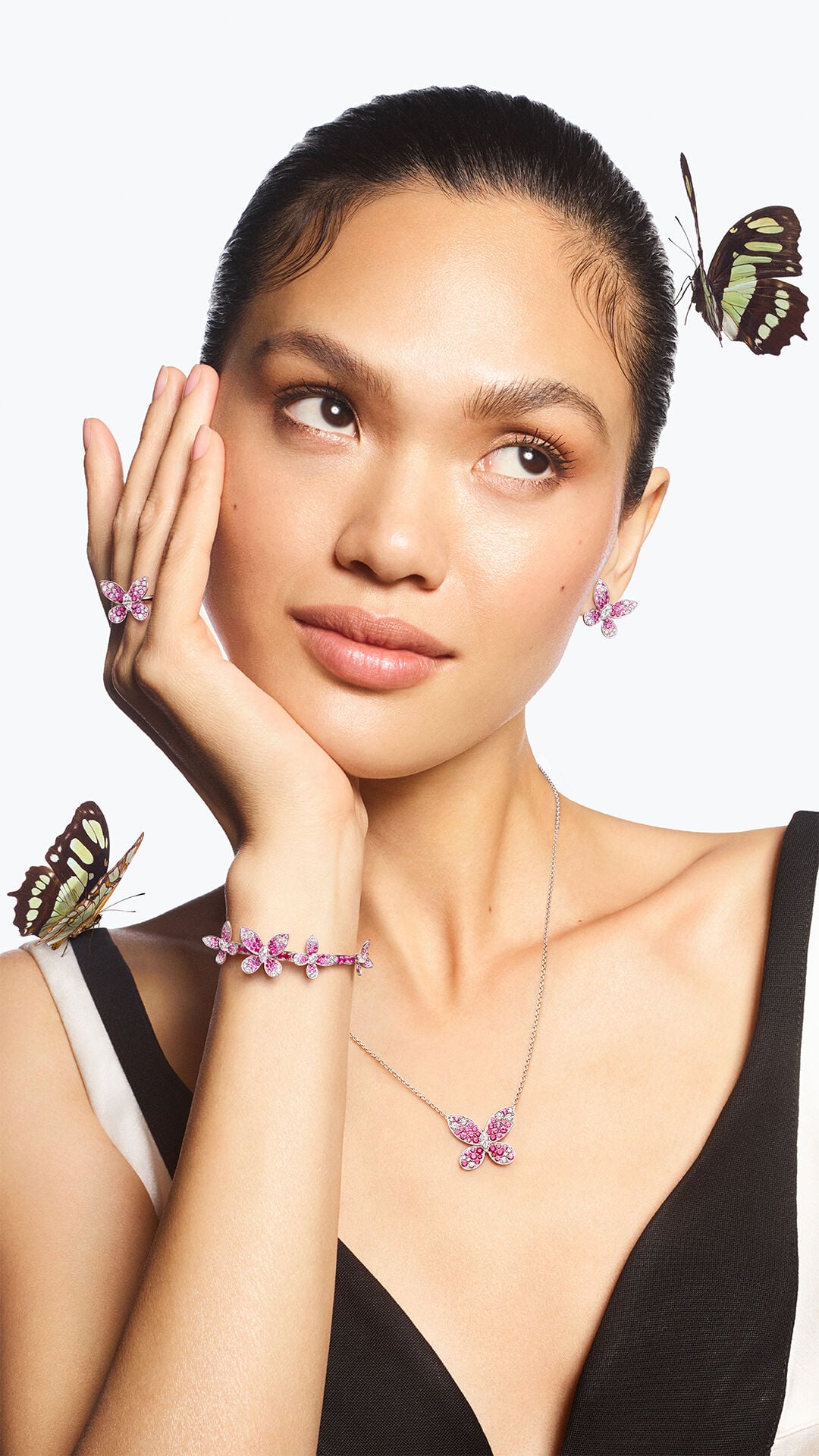 Image shows model wearing Graff Butterfly earrings, ring, necklace and bracelet