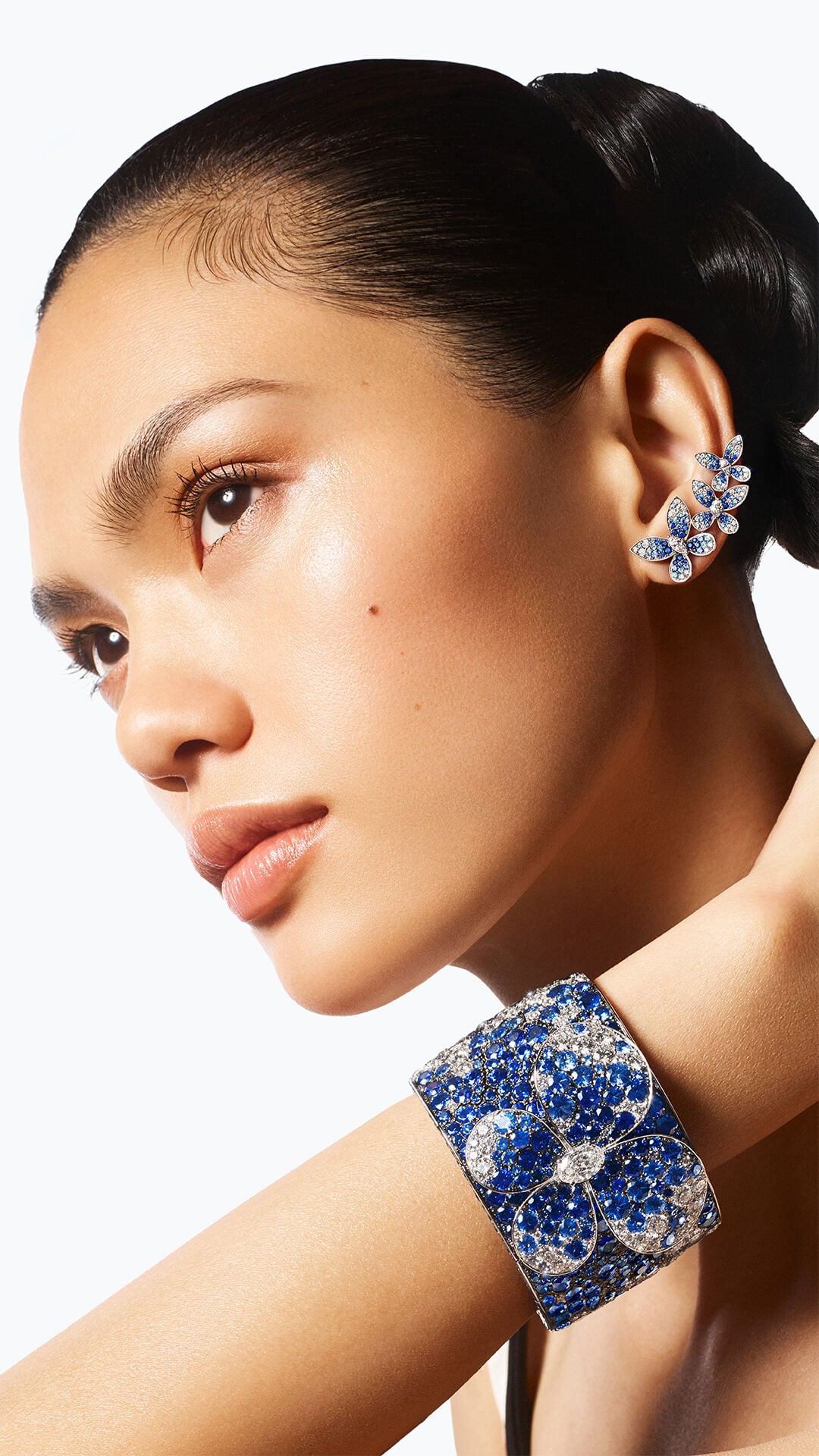 Image shows model wearing Graff Butterfly cuff and earrings