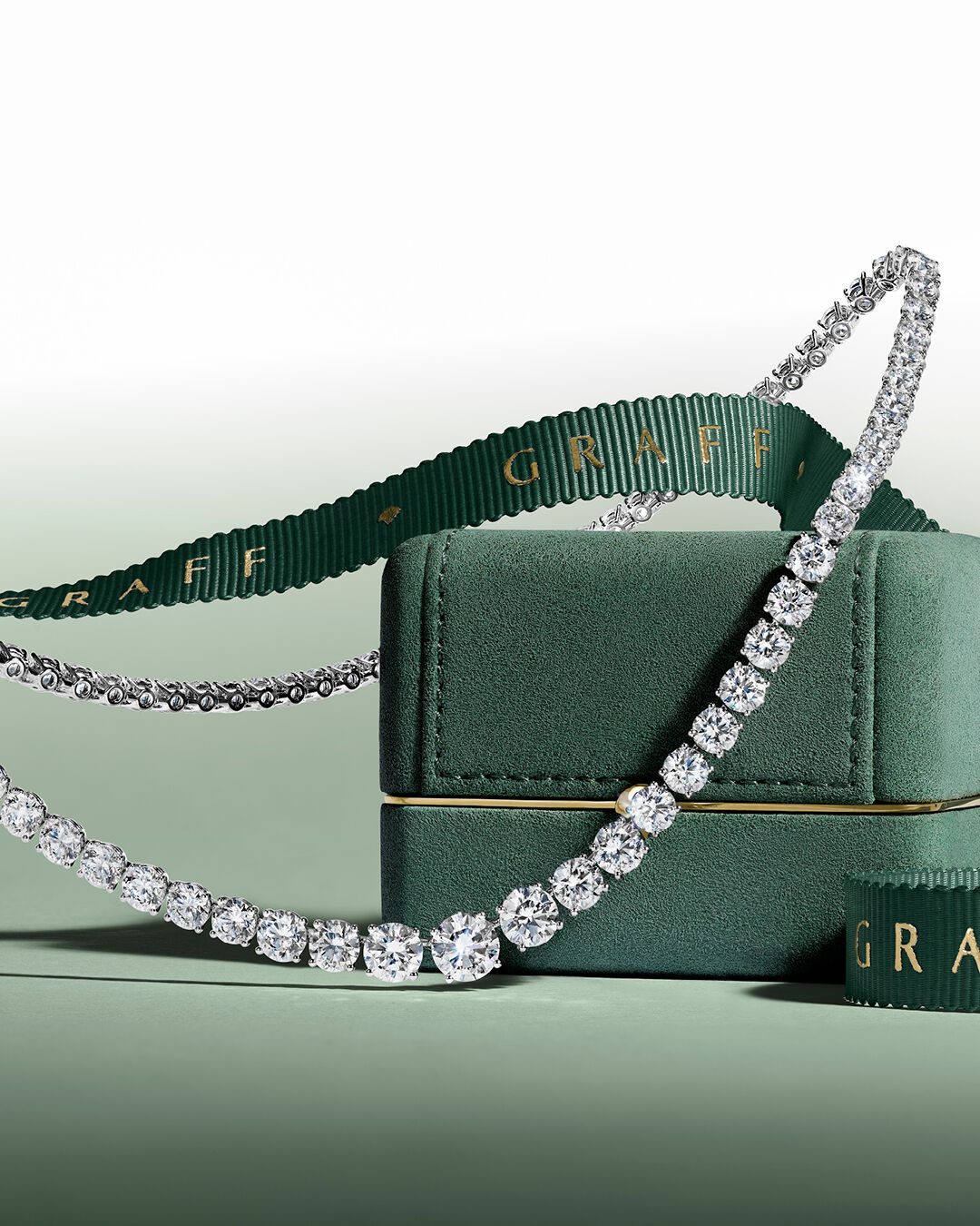 Image shows Graff Round Diamond necklace and Graff box and ribbon