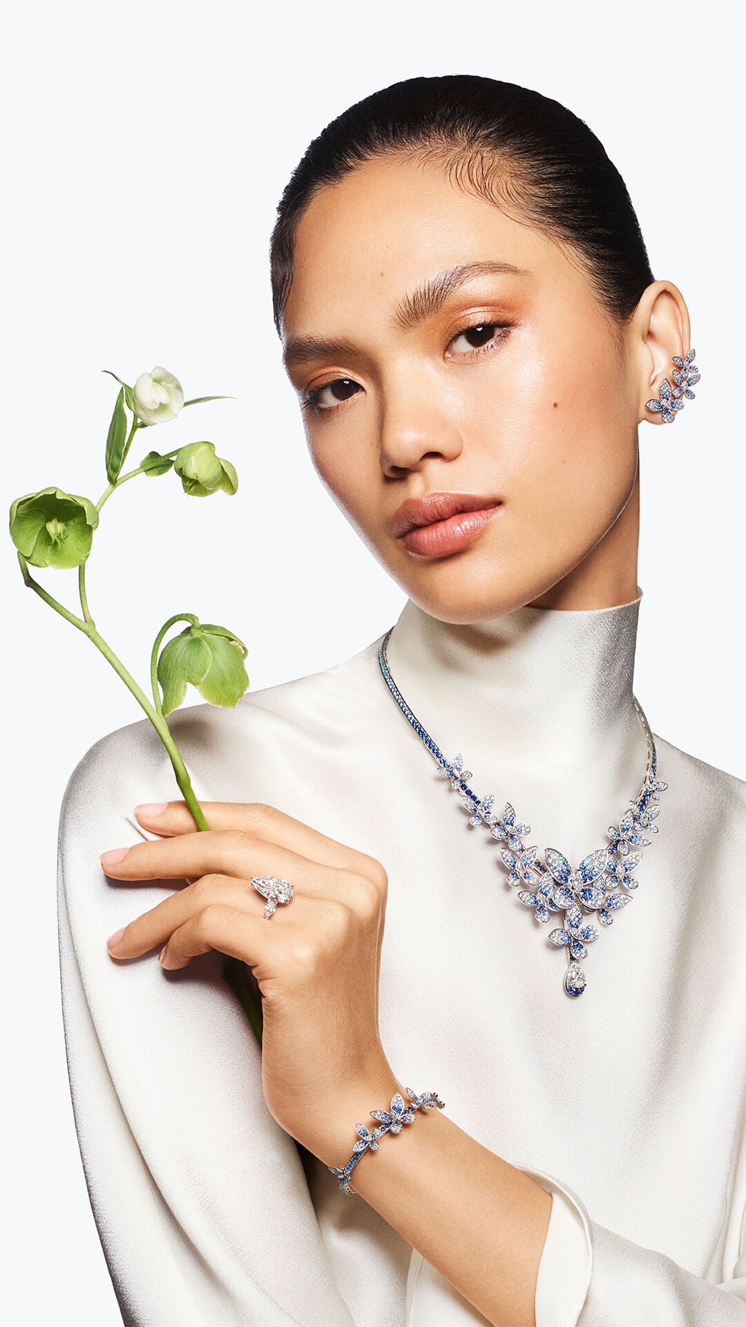 Image shows model wearing Graff Butterfly suite