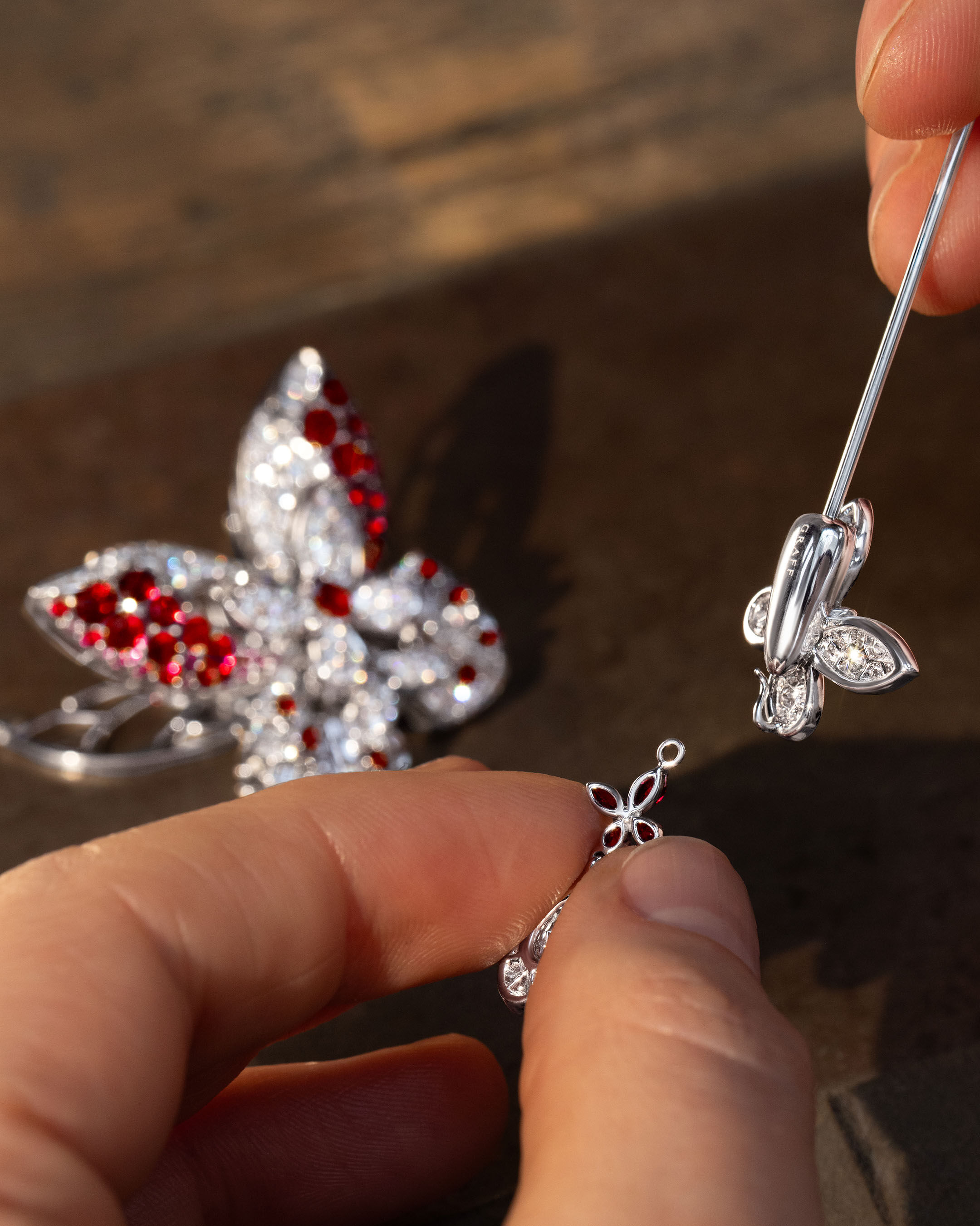 Image shows Graff Butterfly brooch being created in Graff workshop