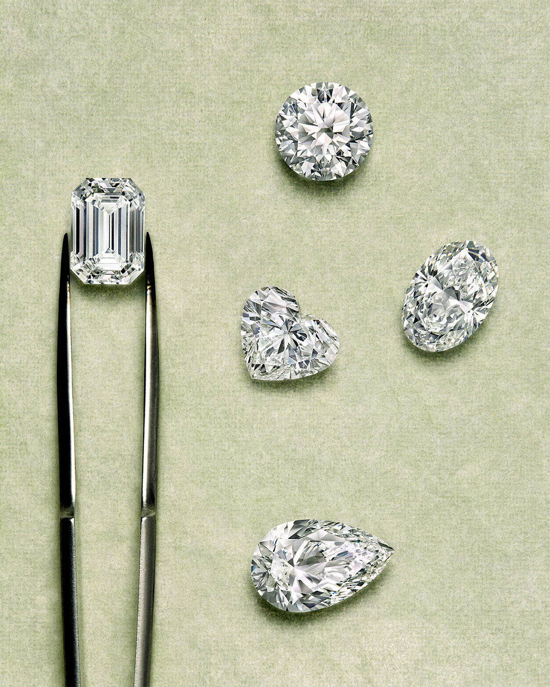 Guide to diamond certification - image shows Graff diamond engagement ring and workshop tools